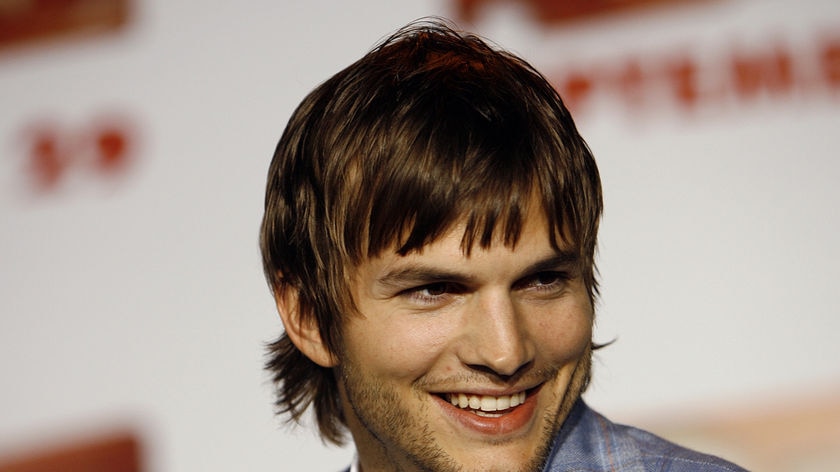 Ashton Kutcher smiles