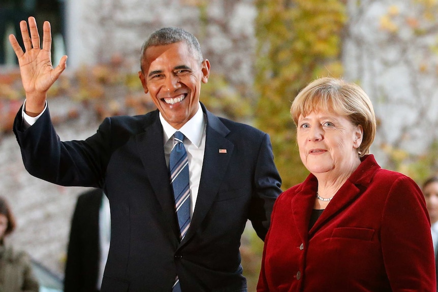 Barack Obama is welcomed by German Chancellor Angela Merkel
