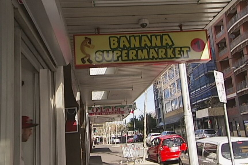 A shop sign for the Banana Supermarket, which doubles as the hub for an illegal accommodation network in Sydney