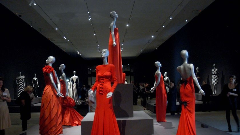 A selection of Valentino's signature red dresses on show at Brisbane's GoMA.