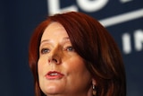 Julia Gillard urged federal MPs to invoke the spirit of Ben Chifley