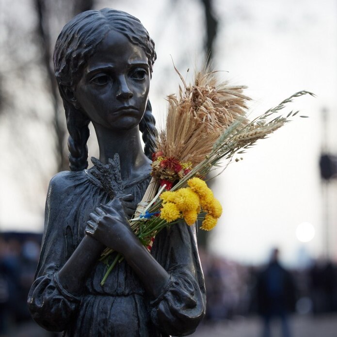 Statue of a malnourish girl holding a sheaf of wheat, memorialising the Ukraine famine of 1932 to 1933
