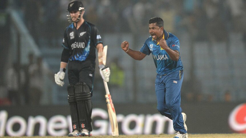 Sri Lanka's Rangana Herath celebrates the wicket of New Zealand's Jimmy Neesham at the World T20.