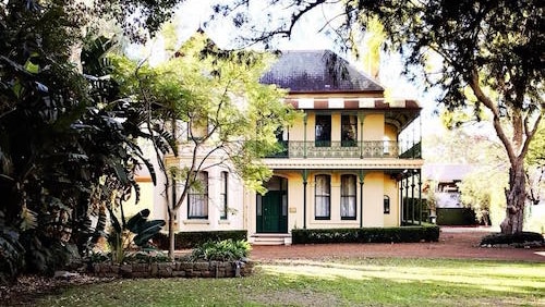 A historical house surrounded by trees