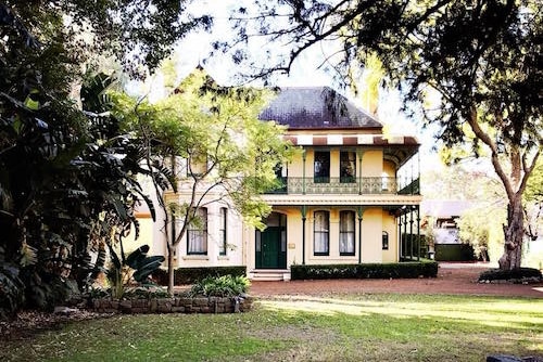 A historical house surrounded by trees