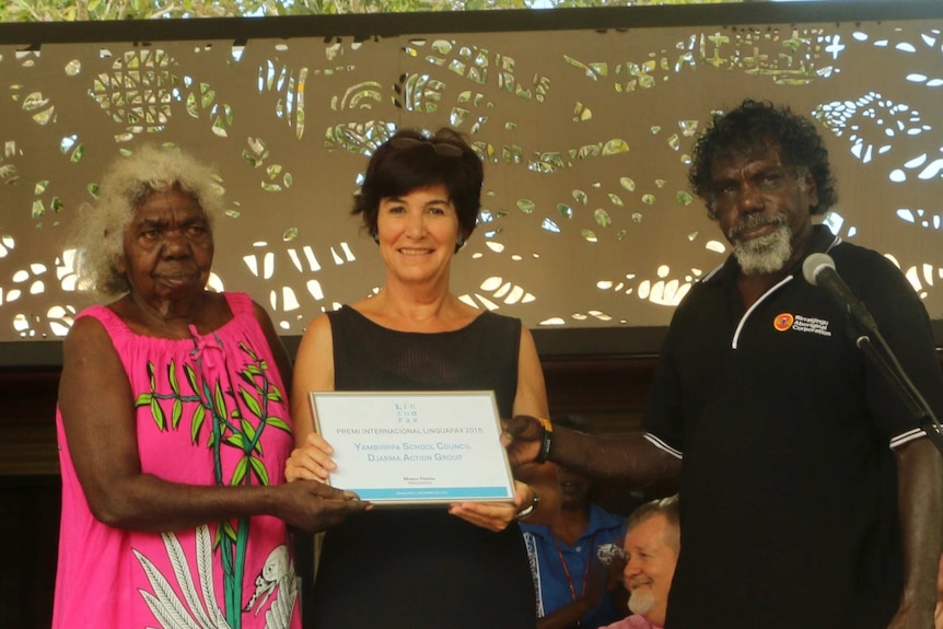 Yirrkala school council members receive an award for the bilingual teaching program