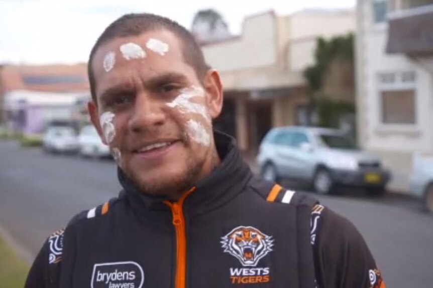 JImmy Cutmore wears a Wests Tigers jumper.