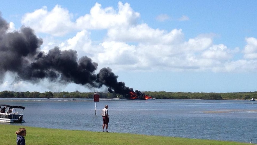 A boat on fire near Jacobs Well Marina