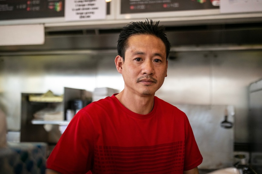 A man in a red t-shirt.