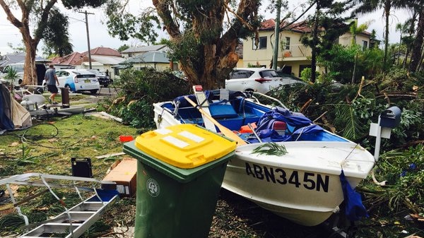 A small speed boat lodged among debris in Kurnell.