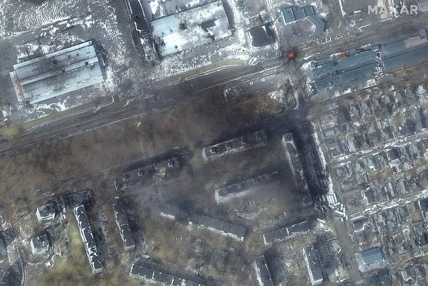 A satellite image shows destroyed apartment buildings in Mariupol.