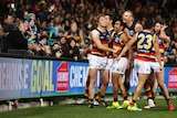 Eddie Betts celebrates in front of Port Adelaide fans