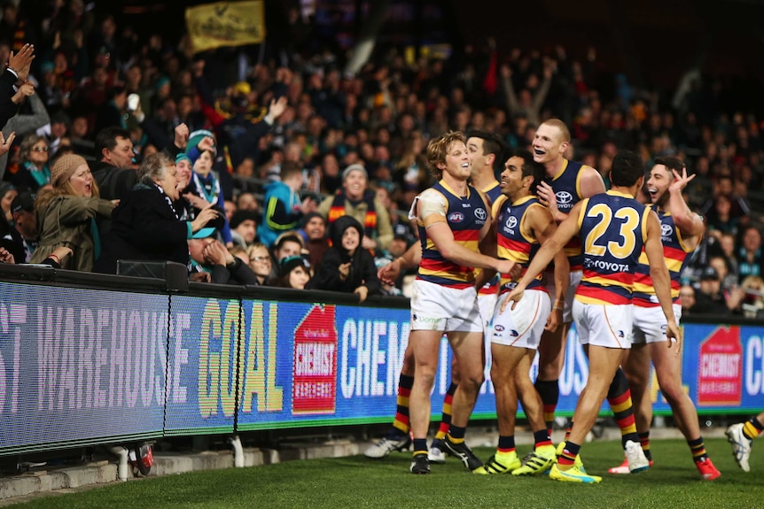 Eddie Betts celebrates in front of Port Adelaide fans