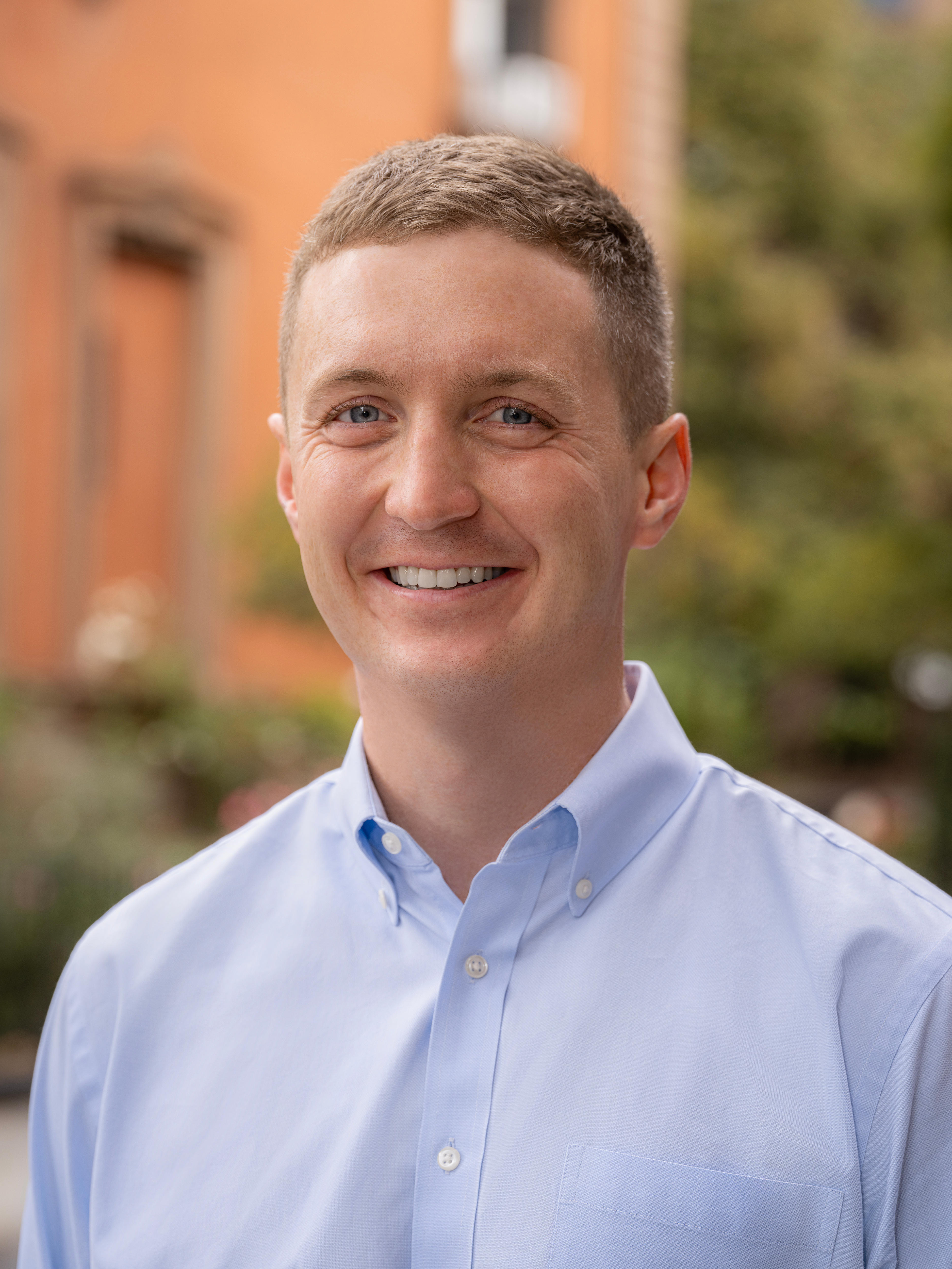 Young white man wearing blue collared shirt