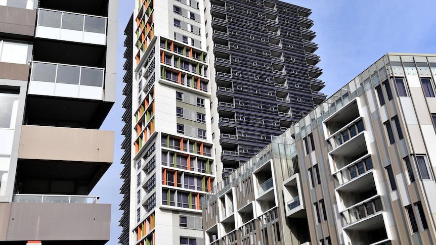 A row of high-rise apartment units.