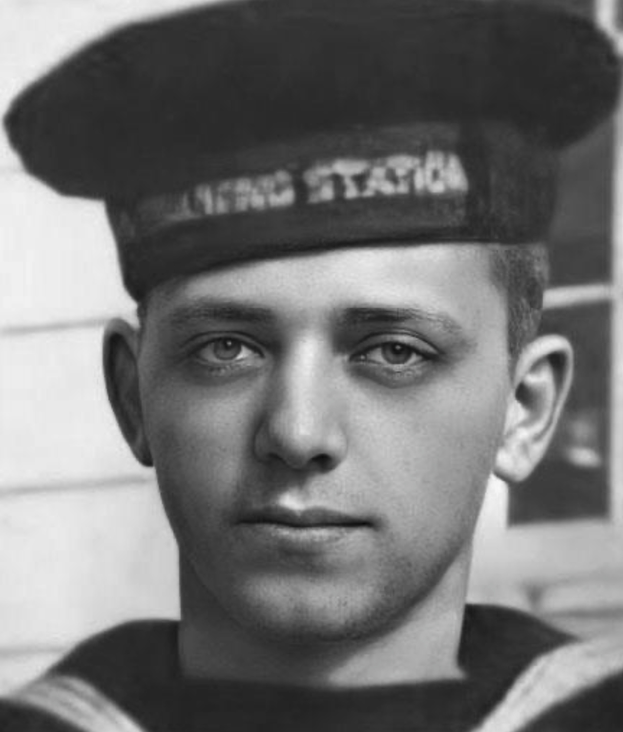 Headshot of young man in Navy uniform