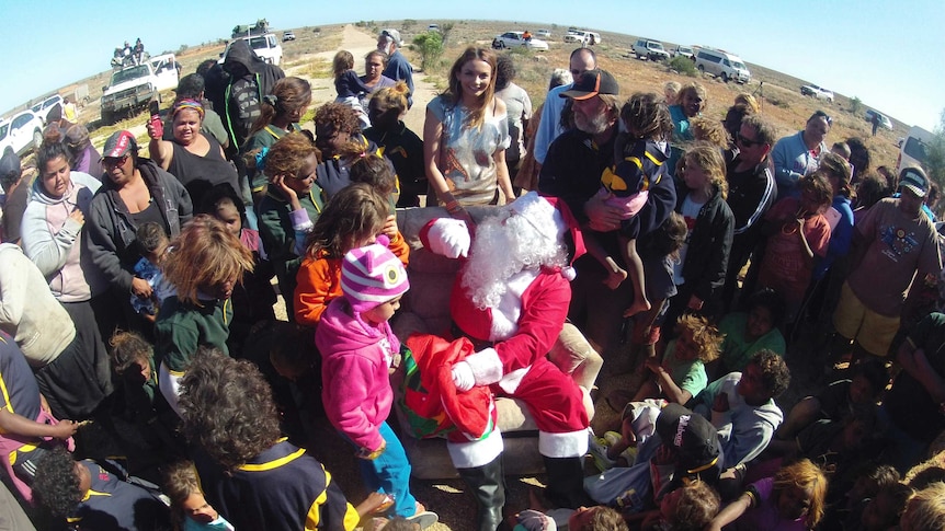 Santa and Ricki Lee meet the kids at Watson Station