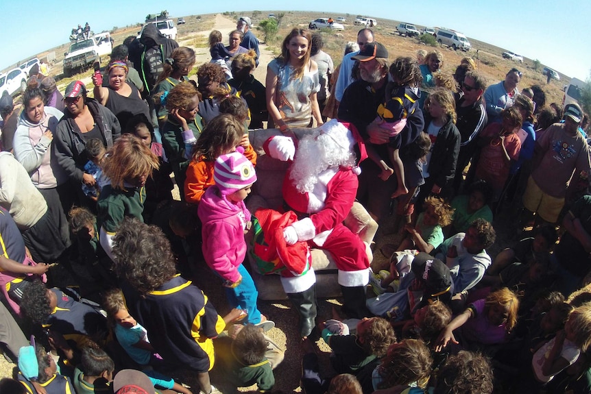 Santa and Ricki Lee meet the kids at Watson Station