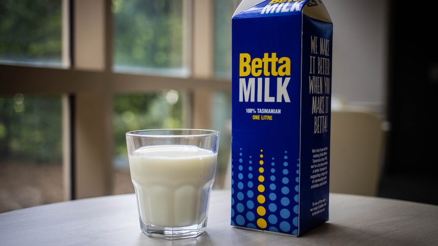 carton of milk and glass of milk