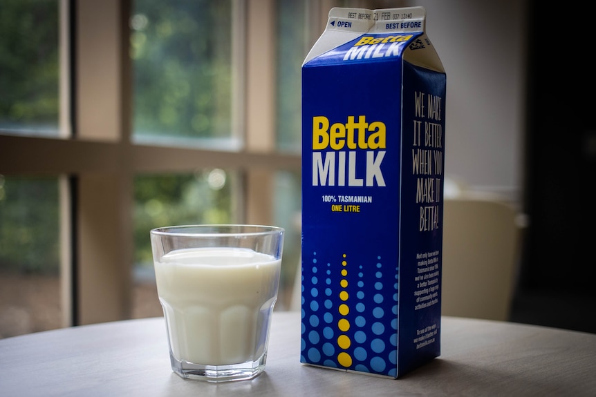 carton of milk and glass of milk