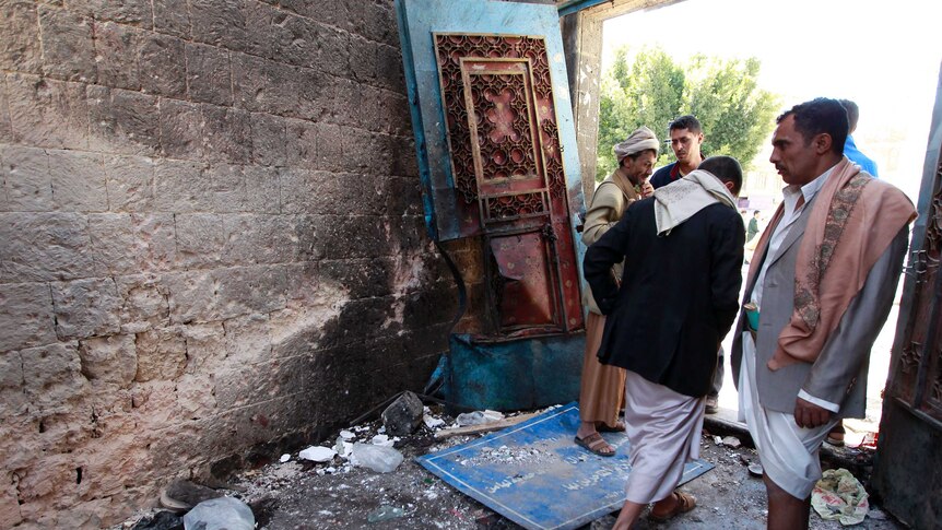 A Yemeni Huthi rebel checks the mosque in the capital Sanaa following an explosion