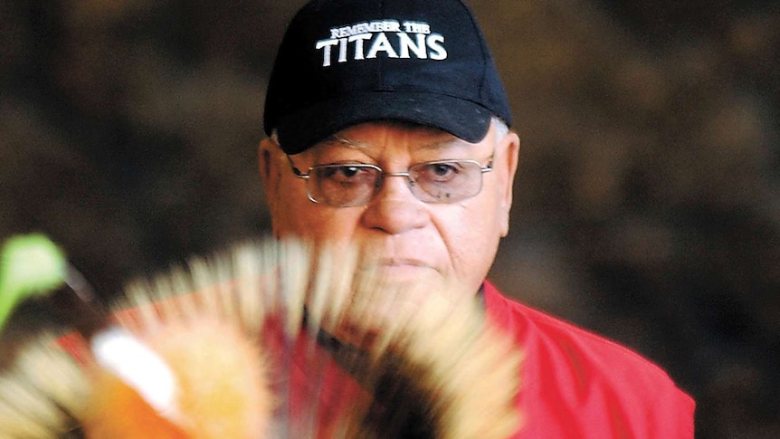 Herman Boone wearing a remember the titans cap