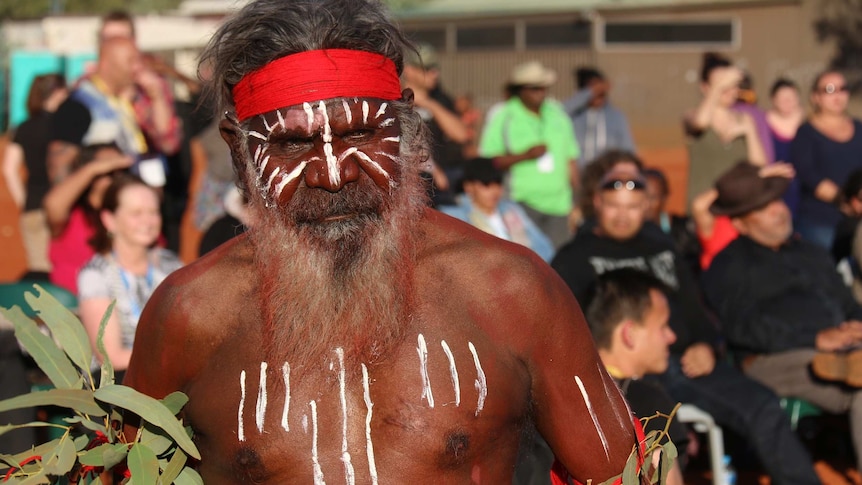 An Indigenous dancer at at the closing ceremony of talks at Uluru.