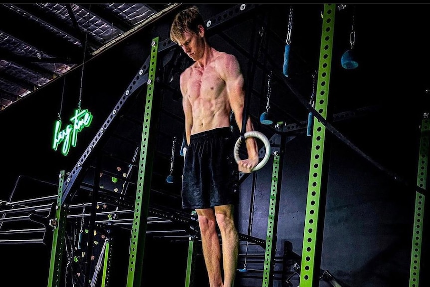 Mac Rogers attempts the world record for most ring muscle ups in one hour. 
