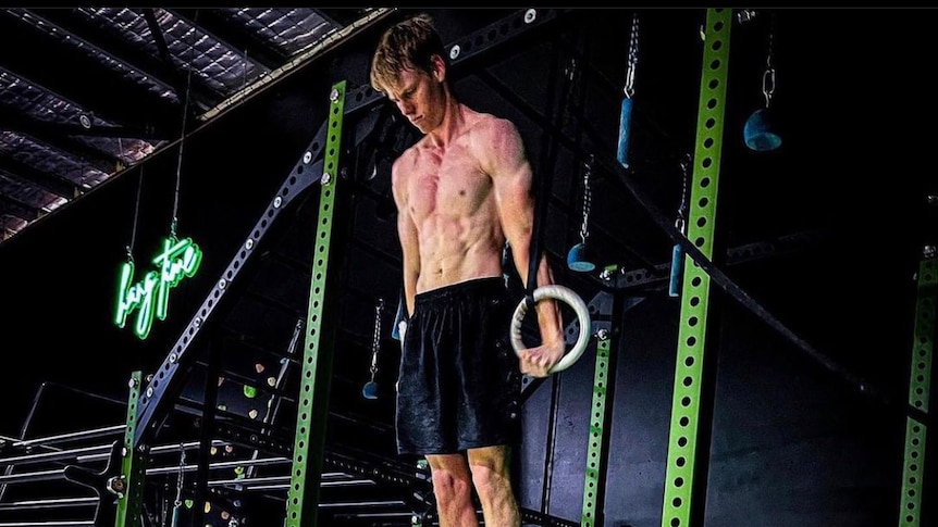 Mac Rogers attempts the world record for most ring muscle ups in one hour. 