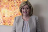 Perth Lord Mayor Lisa Scaffidi stands in front of a painting in her Perth office.