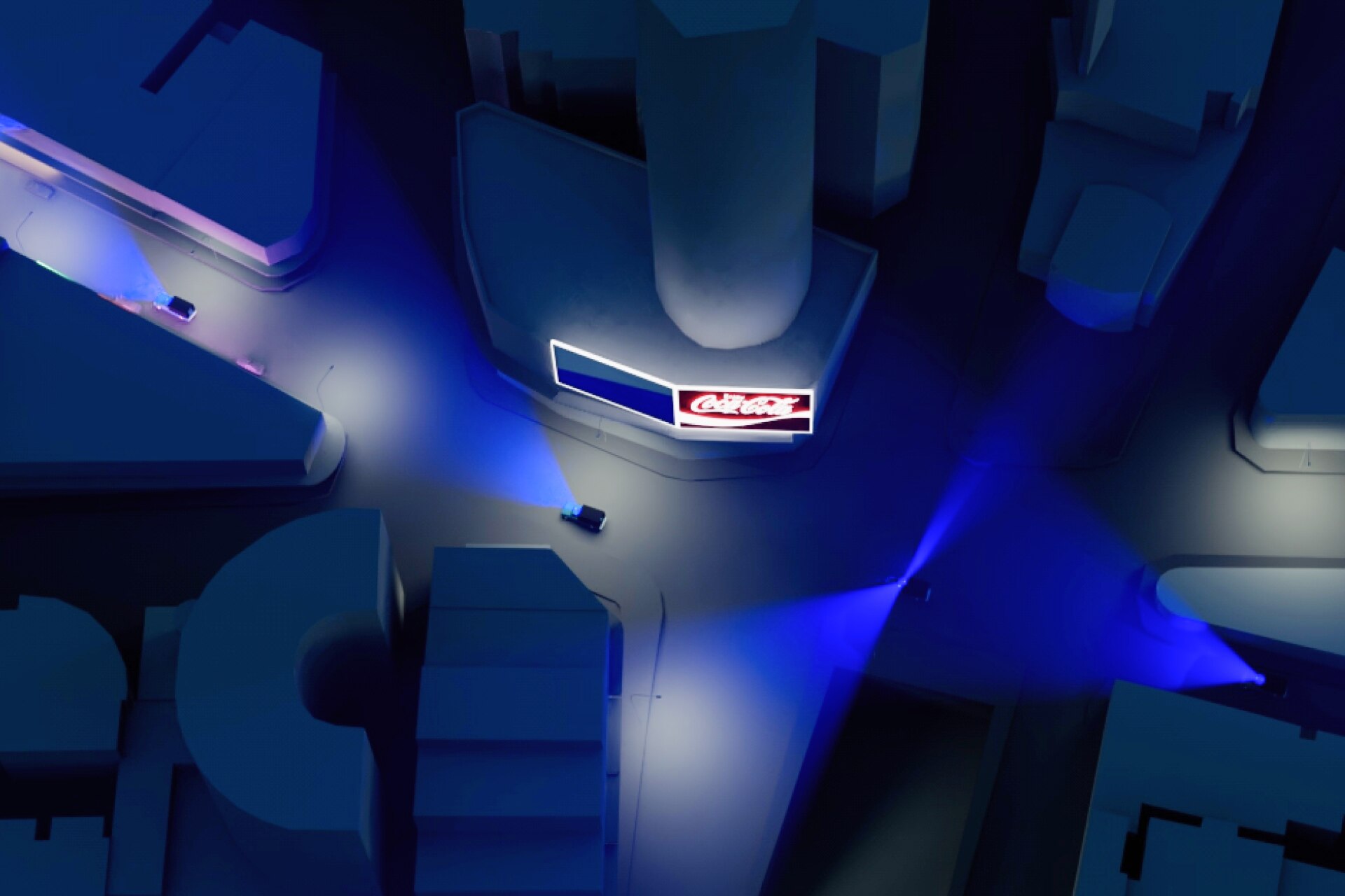 A stylised street scene shown from above, with blue lights and small police cars visible