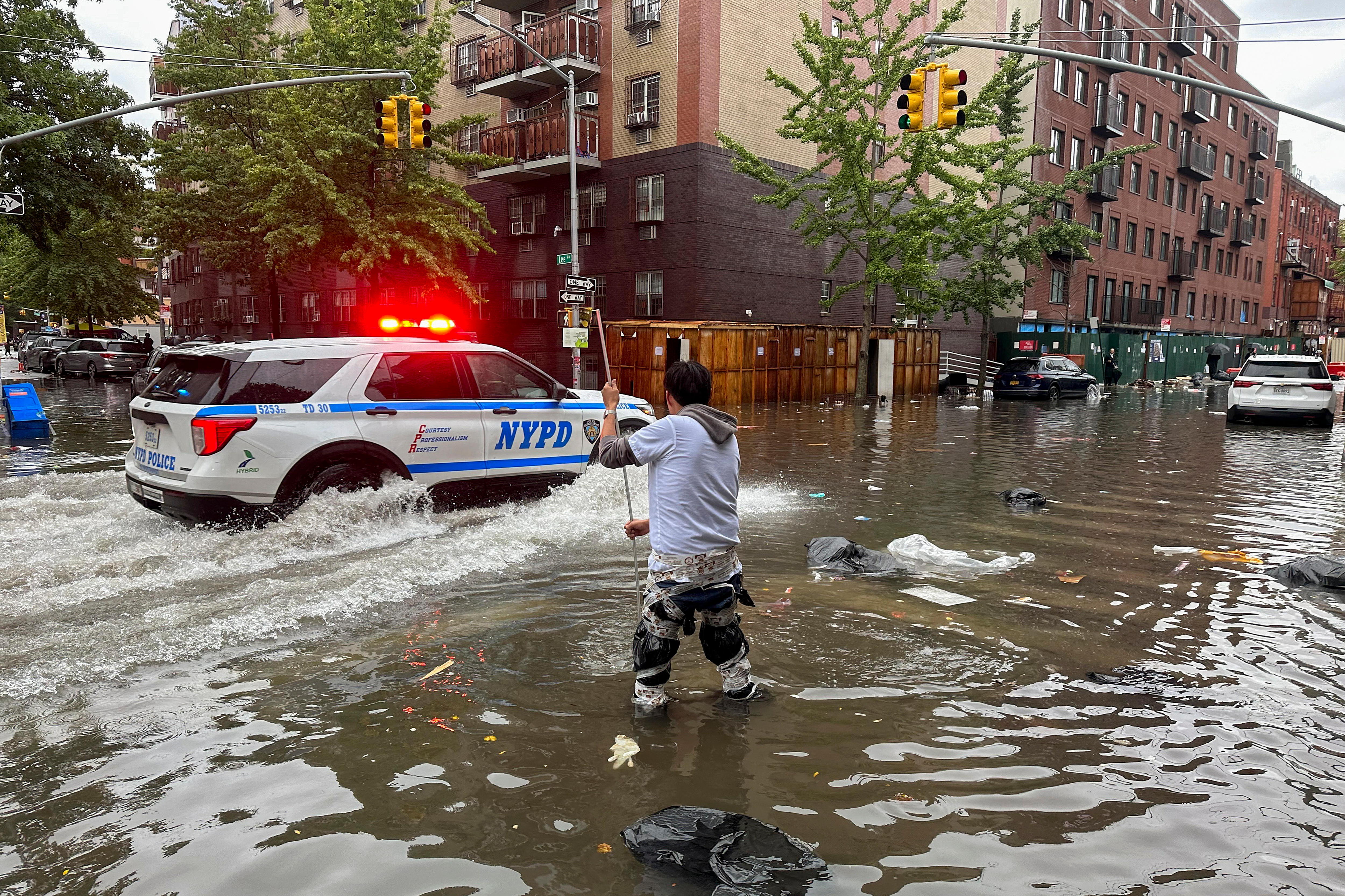 A man stands in knee-deep water.