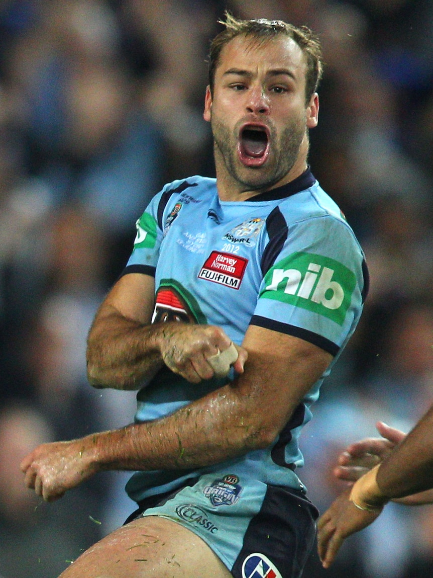 Brett Stewart of the Blues celebrates scoring a try during game two of the ARL State of Origin series