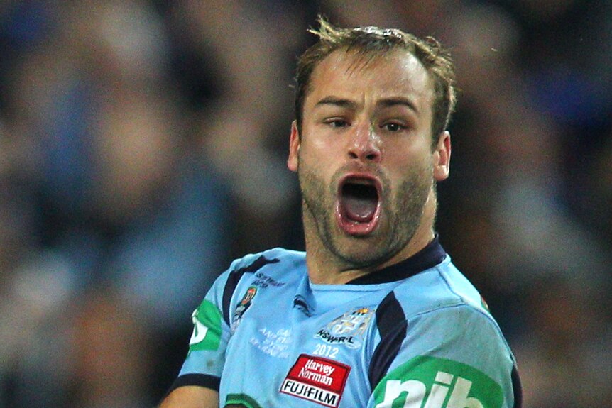 Brett Stewart of the Blues celebrates scoring a try during game two of the ARL State of Origin series