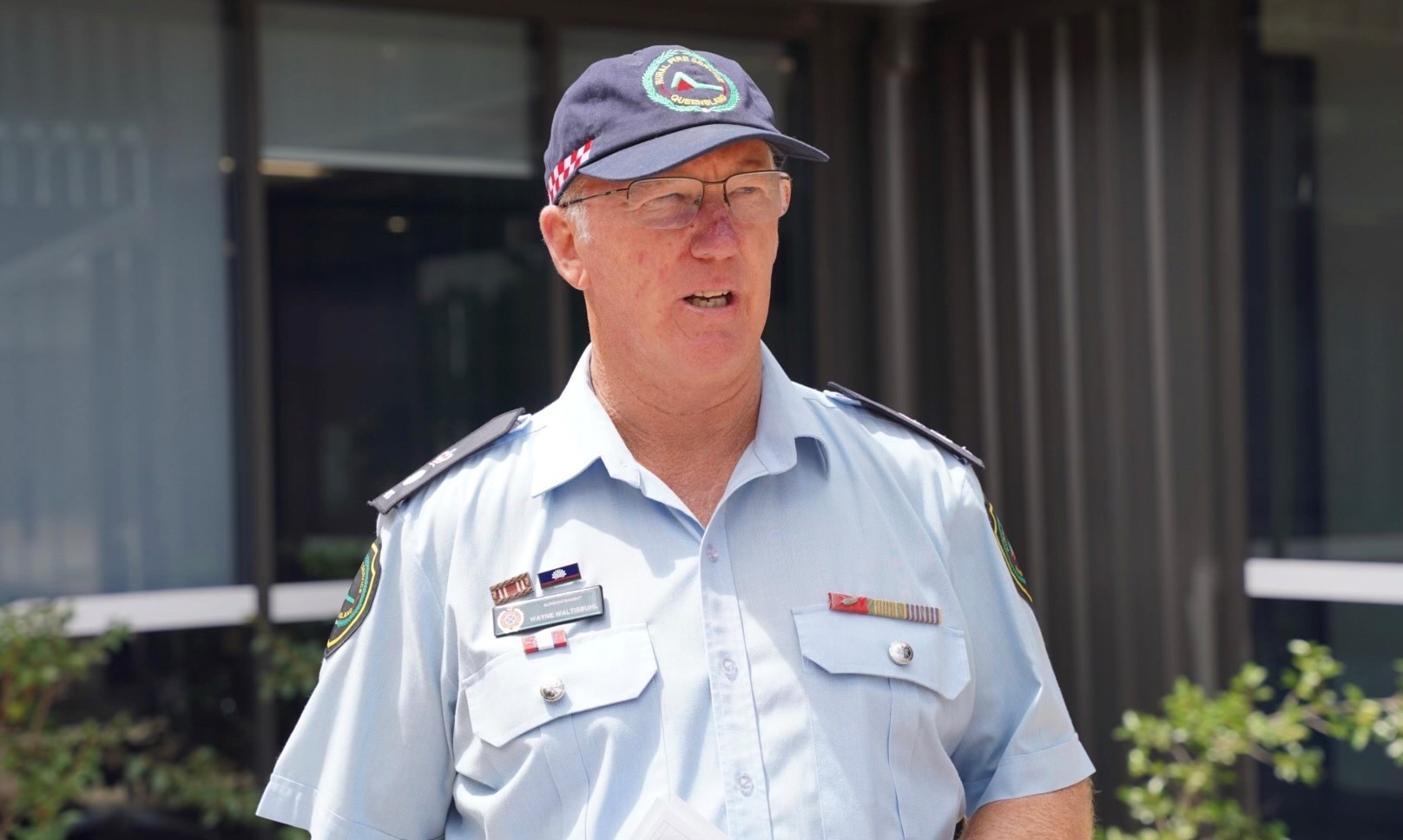 A man wearing a blue uniform