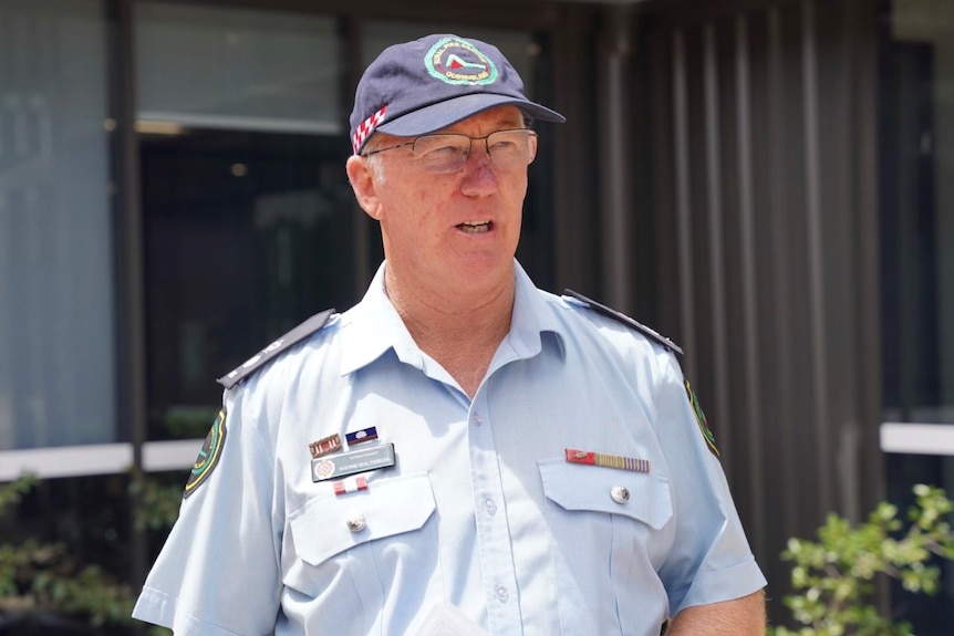 A man wearing a blue uniform