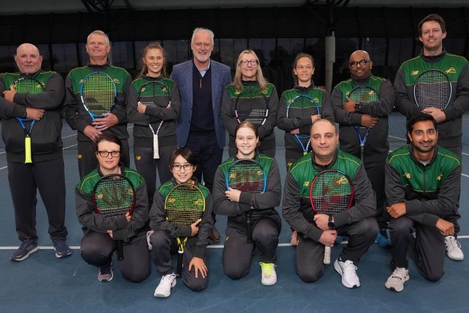A group of blind tennis players and coaches