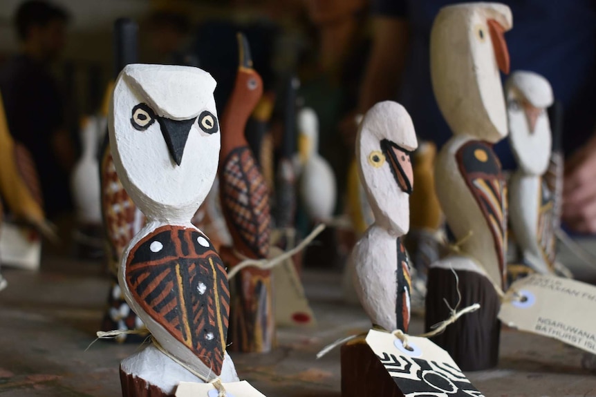 Carved and painted wooden owls.