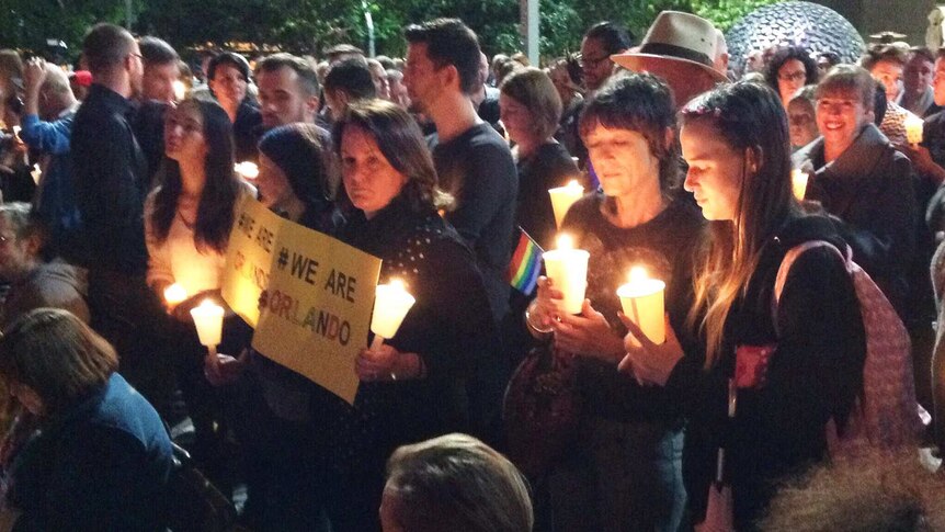 People held candles to support the victims of the Orlando shooting.