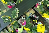 An aerial view of workers making bouquets in a Lynch Group warehouse.