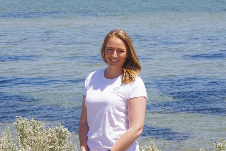 Chantel Foord standing in front of beach