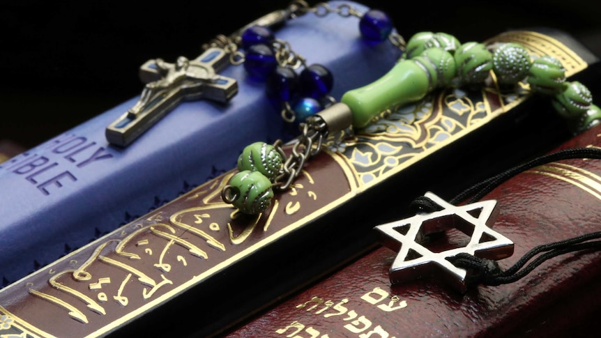 Bible, Quran and Bible. Interfaith symbols
