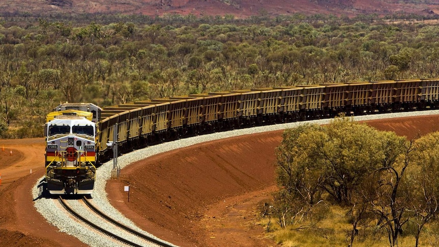 An expansive photo of an iron ore train.