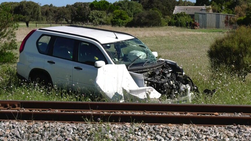 The wreckage of a car hit by a train. 
