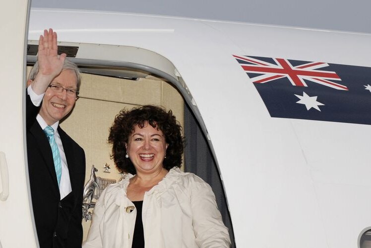 Kevin Rudd and Therese Rein wave from a plane