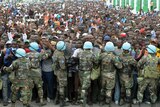 UN peacekeepers try and control Haitians queueing for aid
