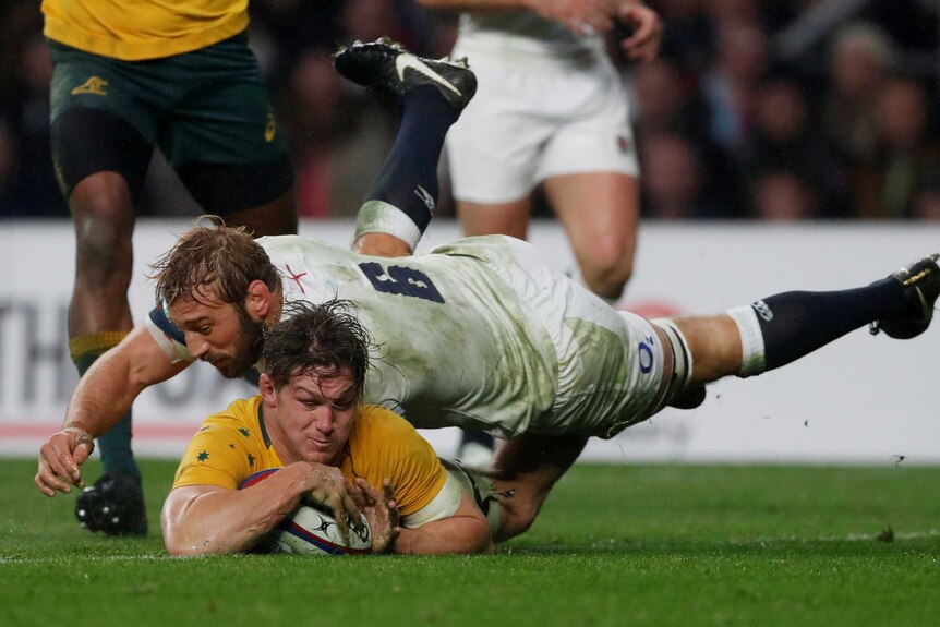 Australia’s Michael Hooper scores a try against England at Twickenham which is later disallowed.