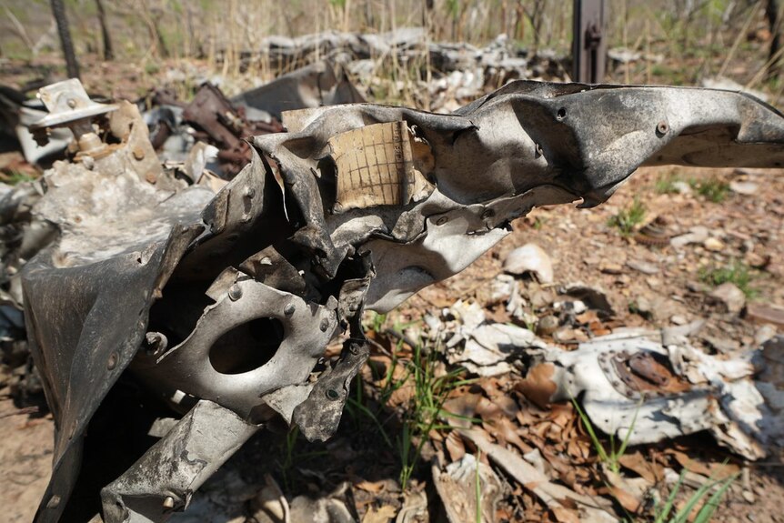 Twisted plane wreckage is seen on the ground at Litchfield National Park.