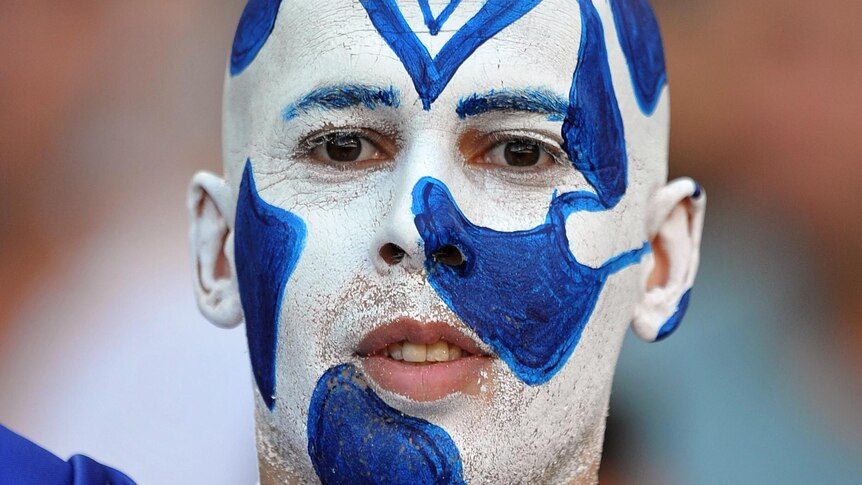 A Canterbury-Bankstown Bulldogs fan waits for the start of the NRL grand final.