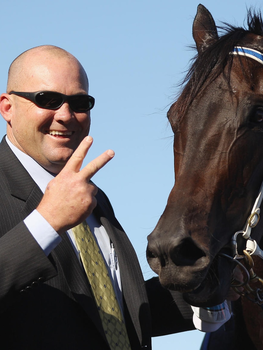 Trainer Peter Moody poses with Black Caviar (Getty Images: Mark Kolbe)